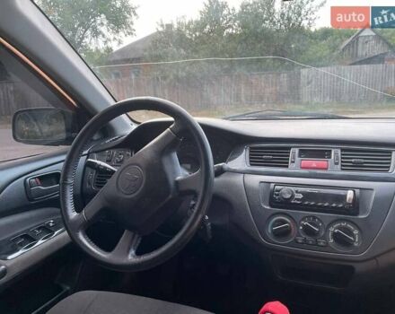 Черный Мицубиси Лансер, объемом двигателя 1.58 л и пробегом 172 тыс. км за 5700 $, фото 6 на Automoto.ua