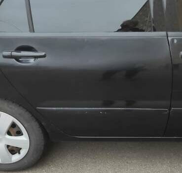 Черный Мицубиси Лансер, объемом двигателя 1.58 л и пробегом 240 тыс. км за 3700 $, фото 4 на Automoto.ua