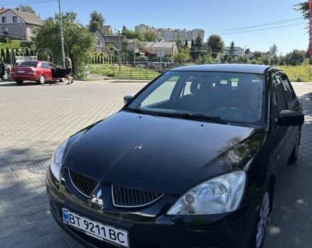 Мицубиси Лансер 2004 в Львове на Automoto.ua Черный Мицубиси Лансер, объемом двигателя 1.58 л и пробегом 463 тыс. км за 3900 $, фото 23 на Automoto.ua