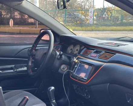 Мицубиси Лансер 2004 в Харькове на Automoto.ua Черный Мицубиси Лансер, объемом двигателя 1.58 л и пробегом 230 тыс. км за 2899 $, фото 6 на Automoto.ua