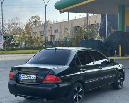 Мицубиси Лансер 2004 в Харькове на Automoto.ua Черный Мицубиси Лансер, объемом двигателя 1.58 л и пробегом 230 тыс. км за 2899 $, фото 4 на Automoto.ua