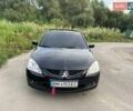 Черный Мицубиси Лансер, объемом двигателя 1.58 л и пробегом 172 тыс. км за 5700 $, фото 1 на Automoto.ua