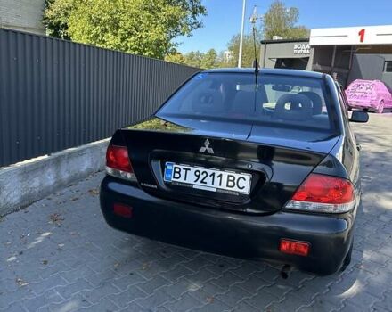Мицубиси Лансер 2004 в Львове на Automoto.ua Черный Мицубиси Лансер, объемом двигателя 1.58 л и пробегом 463 тыс. км за 3900 $, фото 6 на Automoto.ua
