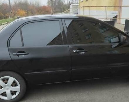 Черный Мицубиси Лансер, объемом двигателя 1.58 л и пробегом 240 тыс. км за 3700 $, фото 2 на Automoto.ua