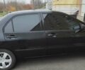 Черный Мицубиси Лансер, объемом двигателя 1.58 л и пробегом 240 тыс. км за 3700 $, фото 2 на Automoto.ua