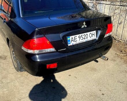 Черный Мицубиси Лансер, объемом двигателя 1.6 л и пробегом 280 тыс. км за 3000 $, фото 1 на Automoto.ua