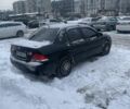 Черный Мицубиси Лансер, объемом двигателя 1.6 л и пробегом 2 тыс. км за 3300 $, фото 1 на Automoto.ua