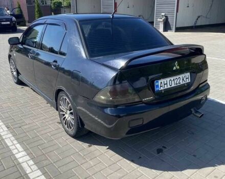Чорний Міцубісі Lancer, об'ємом двигуна 2 л та пробігом 290 тис. км за 5550 $, фото 2 на Automoto.ua