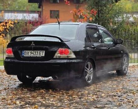 Чорний Міцубісі Lancer, об'ємом двигуна 2 л та пробігом 320 тис. км за 5700 $, фото 1 на Automoto.ua
