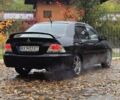 Чорний Міцубісі Lancer, об'ємом двигуна 2 л та пробігом 320 тис. км за 5700 $, фото 1 на Automoto.ua