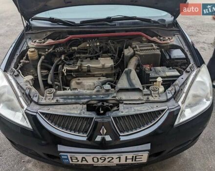 Черный Мицубиси Лансер, объемом двигателя 1.58 л и пробегом 240 тыс. км за 3700 $, фото 7 на Automoto.ua