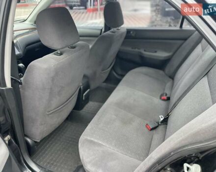 Чорний Міцубісі Lancer, об'ємом двигуна 1.58 л та пробігом 290 тис. км за 3900 $, фото 17 на Automoto.ua
