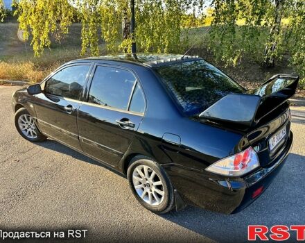 Черный Мицубиси Лансер, объемом двигателя 1.6 л и пробегом 300 тыс. км за 3650 $, фото 2 на Automoto.ua