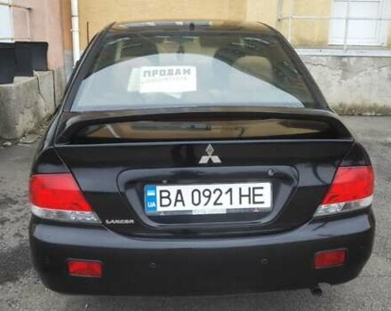 Черный Мицубиси Лансер, объемом двигателя 1.58 л и пробегом 240 тыс. км за 3700 $, фото 8 на Automoto.ua