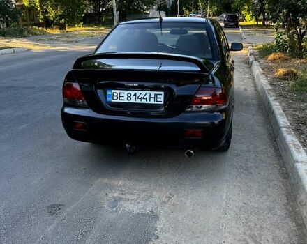 Черный Мицубиси Лансер, объемом двигателя 1.6 л и пробегом 263 тыс. км за 4200 $, фото 1 на Automoto.ua