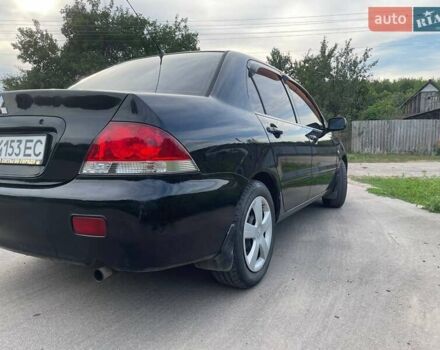 Черный Мицубиси Лансер, объемом двигателя 1.58 л и пробегом 172 тыс. км за 5700 $, фото 4 на Automoto.ua