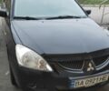 Чорний Міцубісі Lancer, об'ємом двигуна 1.58 л та пробігом 240 тис. км за 3700 $, фото 1 на Automoto.ua