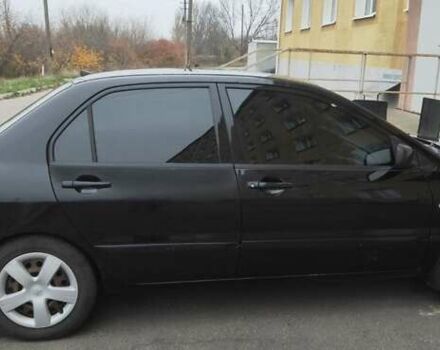 Черный Мицубиси Лансер, объемом двигателя 1.58 л и пробегом 240 тыс. км за 3700 $, фото 3 на Automoto.ua