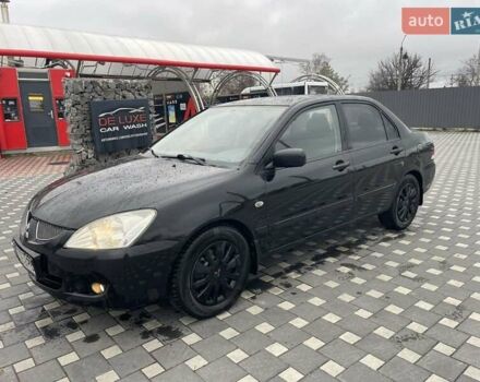 Чорний Міцубісі Lancer, об'ємом двигуна 1.58 л та пробігом 290 тис. км за 3900 $, фото 6 на Automoto.ua