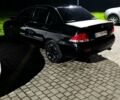 Черный Мицубиси Лансер, объемом двигателя 1.58 л и пробегом 360 тыс. км за 3750 $, фото 1 на Automoto.ua