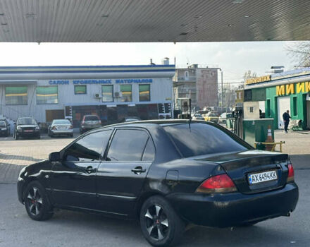 Мицубиси Лансер 2004 в Харькове на Automoto.ua Черный Мицубиси Лансер, объемом двигателя 1.58 л и пробегом 230 тыс. км за 2899 $, фото 3 на Automoto.ua