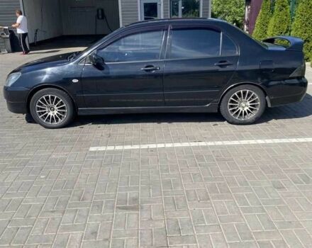 Чорний Міцубісі Lancer, об'ємом двигуна 2 л та пробігом 290 тис. км за 5550 $, фото 1 на Automoto.ua