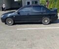 Чорний Міцубісі Lancer, об'ємом двигуна 2 л та пробігом 290 тис. км за 5550 $, фото 1 на Automoto.ua