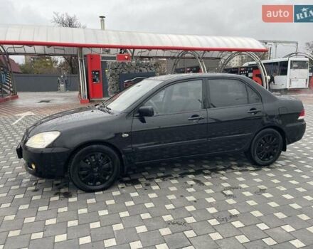 Чорний Міцубісі Lancer, об'ємом двигуна 1.58 л та пробігом 290 тис. км за 3900 $, фото 2 на Automoto.ua