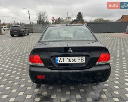 Чорний Міцубісі Lancer, об'ємом двигуна 1.58 л та пробігом 290 тис. км за 3900 $, фото 11 на Automoto.ua