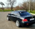 Чорний Міцубісі Lancer, об'ємом двигуна 1.6 л та пробігом 220 тис. км за 5000 $, фото 4 на Automoto.ua