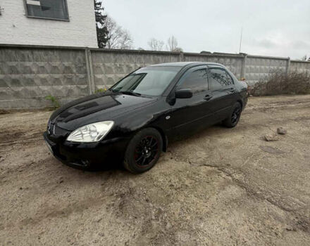 Черный Мицубиси Лансер, объемом двигателя 1.58 л и пробегом 229 тыс. км за 3700 $, фото 4 на Automoto.ua