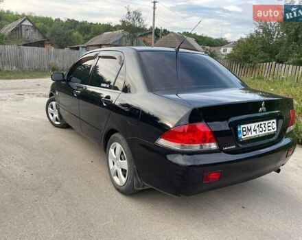 Черный Мицубиси Лансер, объемом двигателя 1.58 л и пробегом 172 тыс. км за 5700 $, фото 3 на Automoto.ua