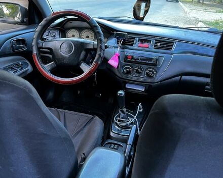 Черный Мицубиси Лансер, объемом двигателя 1.6 л и пробегом 263 тыс. км за 4200 $, фото 2 на Automoto.ua