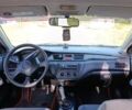 Мицубиси Лансер 2004 в Дрогобыче на Automoto.ua Черный Мицубиси Лансер, объемом двигателя 1.6 л и пробегом 260 тыс. км за 3750 $, фото 10 на Automoto.ua