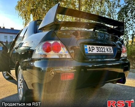 Черный Мицубиси Лансер, объемом двигателя 1.6 л и пробегом 300 тыс. км за 3650 $, фото 5 на Automoto.ua