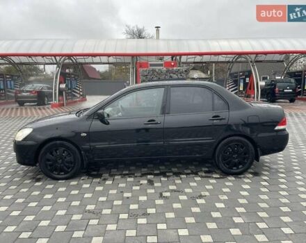 Чорний Міцубісі Lancer, об'ємом двигуна 1.58 л та пробігом 290 тис. км за 3900 $, фото 4 на Automoto.ua
