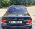 Черный Мицубиси Лансер, объемом двигателя 1.6 л и пробегом 315 тыс. км за 3500 $, фото 1 на Automoto.ua