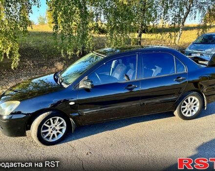 Черный Мицубиси Лансер, объемом двигателя 1.6 л и пробегом 300 тыс. км за 3650 $, фото 1 на Automoto.ua