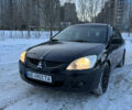 Чорний Міцубісі Lancer, об'ємом двигуна 1.58 л та пробігом 228 тис. км за 4599 $, фото 1 на Automoto.ua