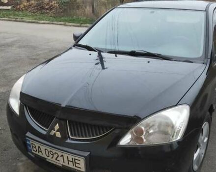 Черный Мицубиси Лансер, объемом двигателя 1.58 л и пробегом 240 тыс. км за 3700 $, фото 1 на Automoto.ua