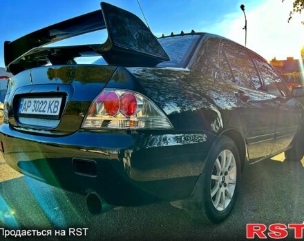 Черный Мицубиси Лансер, объемом двигателя 1.6 л и пробегом 300 тыс. км за 3650 $, фото 4 на Automoto.ua