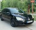 Черный Мицубиси Лансер, объемом двигателя 1.58 л и пробегом 200 тыс. км за 3999 $, фото 1 на Automoto.ua