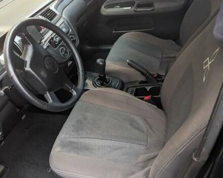 Черный Мицубиси Лансер, объемом двигателя 1.58 л и пробегом 240 тыс. км за 3700 $, фото 14 на Automoto.ua