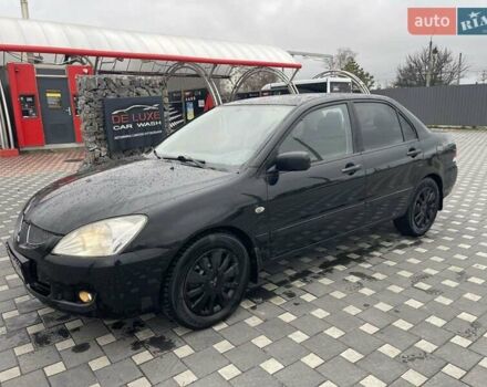 Чорний Міцубісі Lancer, об'ємом двигуна 1.58 л та пробігом 290 тис. км за 3900 $, фото 9 на Automoto.ua
