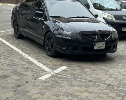 Черный Мицубиси Лансер, объемом двигателя 2 л и пробегом 352 тыс. км за 4100 $, фото 6 на Automoto.ua