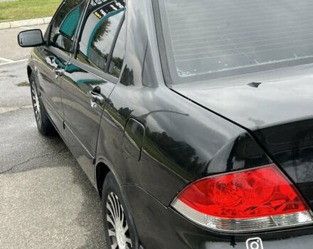 Чорний Міцубісі Lancer, об'ємом двигуна 1.58 л та пробігом 390 тис. км за 4500 $, фото 9 на Automoto.ua