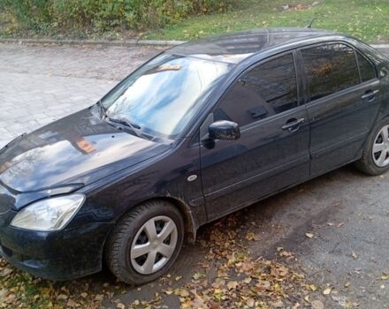 Чорний Міцубісі Lancer, об'ємом двигуна 1.6 л та пробігом 211 тис. км за 3700 $, фото 1 на Automoto.ua