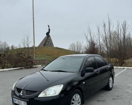 Черный Мицубиси Лансер, объемом двигателя 1.6 л и пробегом 200 тыс. км за 3500 $, фото 1 на Automoto.ua