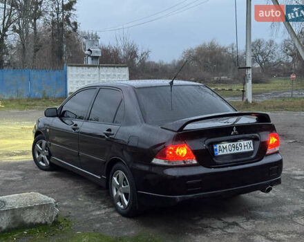 Черный Мицубиси Лансер, объемом двигателя 1.58 л и пробегом 154 тыс. км за 5500 $, фото 43 на Automoto.ua