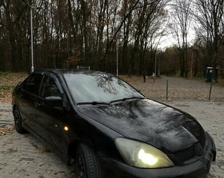 Черный Мицубиси Лансер, объемом двигателя 1.6 л и пробегом 200 тыс. км за 3000 $, фото 5 на Automoto.ua